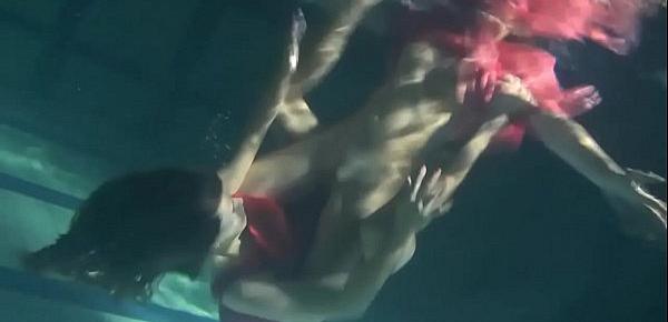  Two hot lesbians underwater touching each-other. Young girls schoolgirls are naked in the pool. Young nudists ..